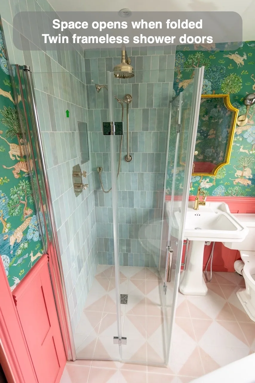 Space opens when folded — Twin frameless shower doors