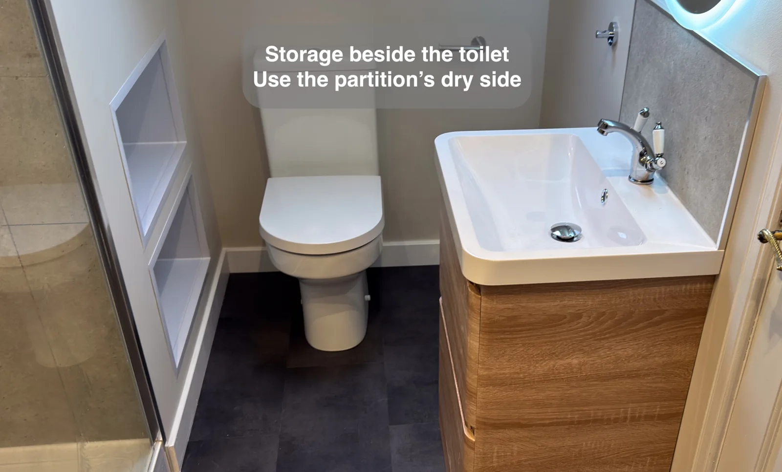 White-lined storage cubbies on the dry side of a shower partition
