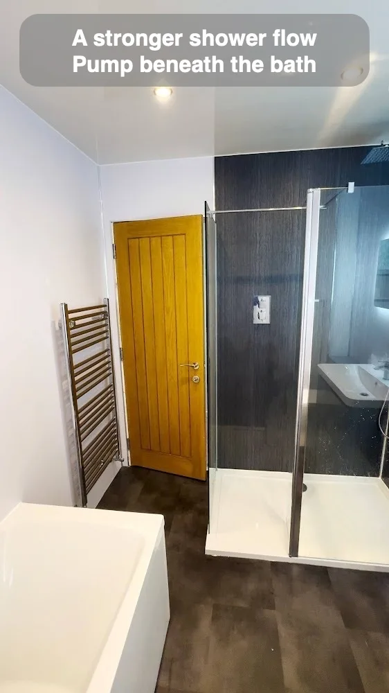 A stronger shower flow — Pump beneath the bath