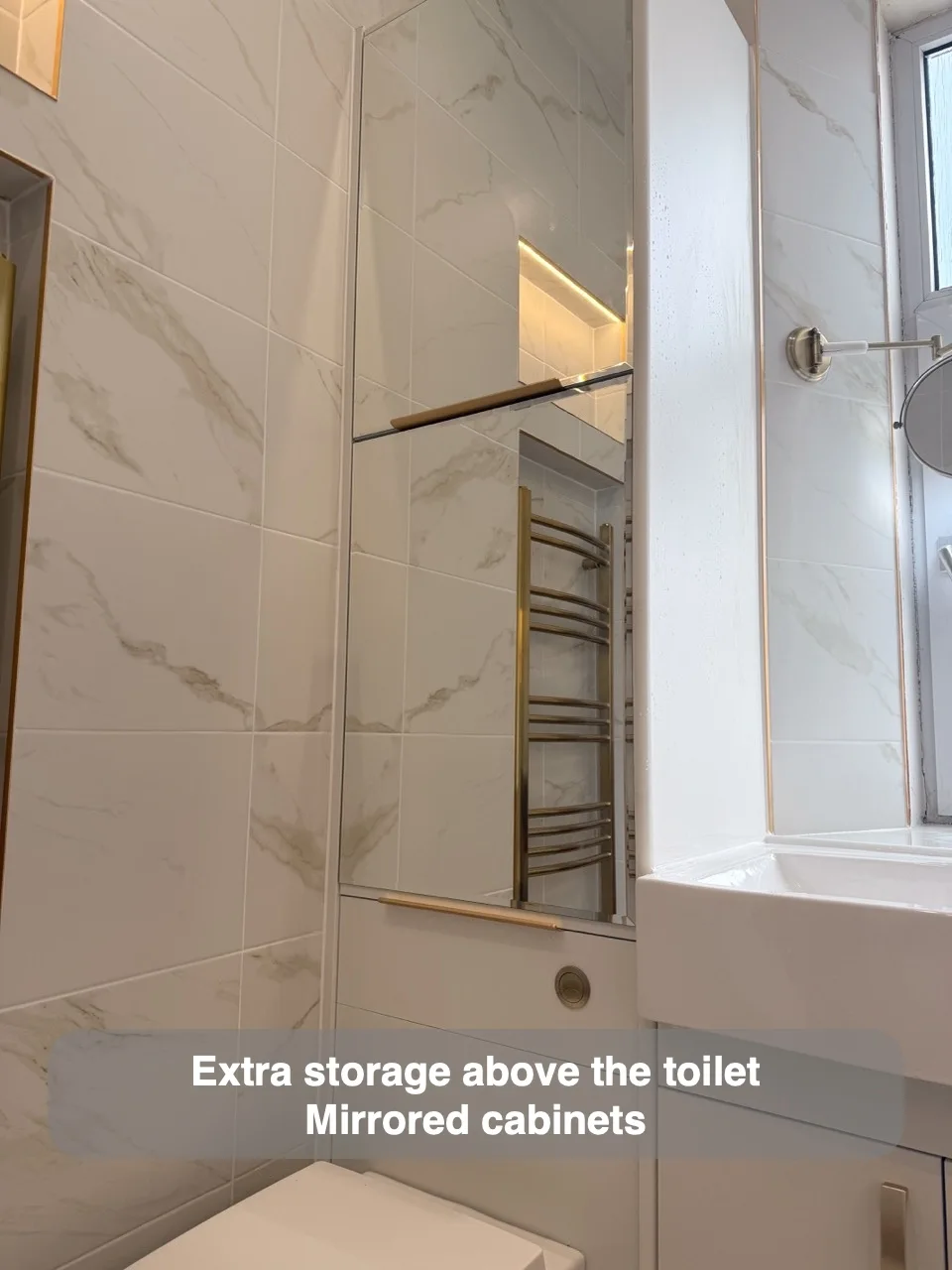 Extra storage above the toilet — Mirrored cabinets
