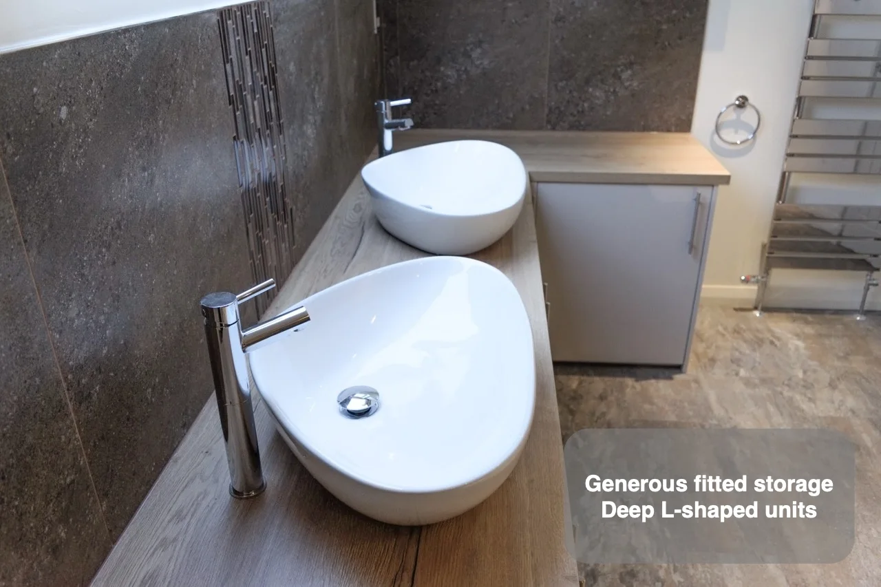 Generous fitted storage — Deep L-shaped units