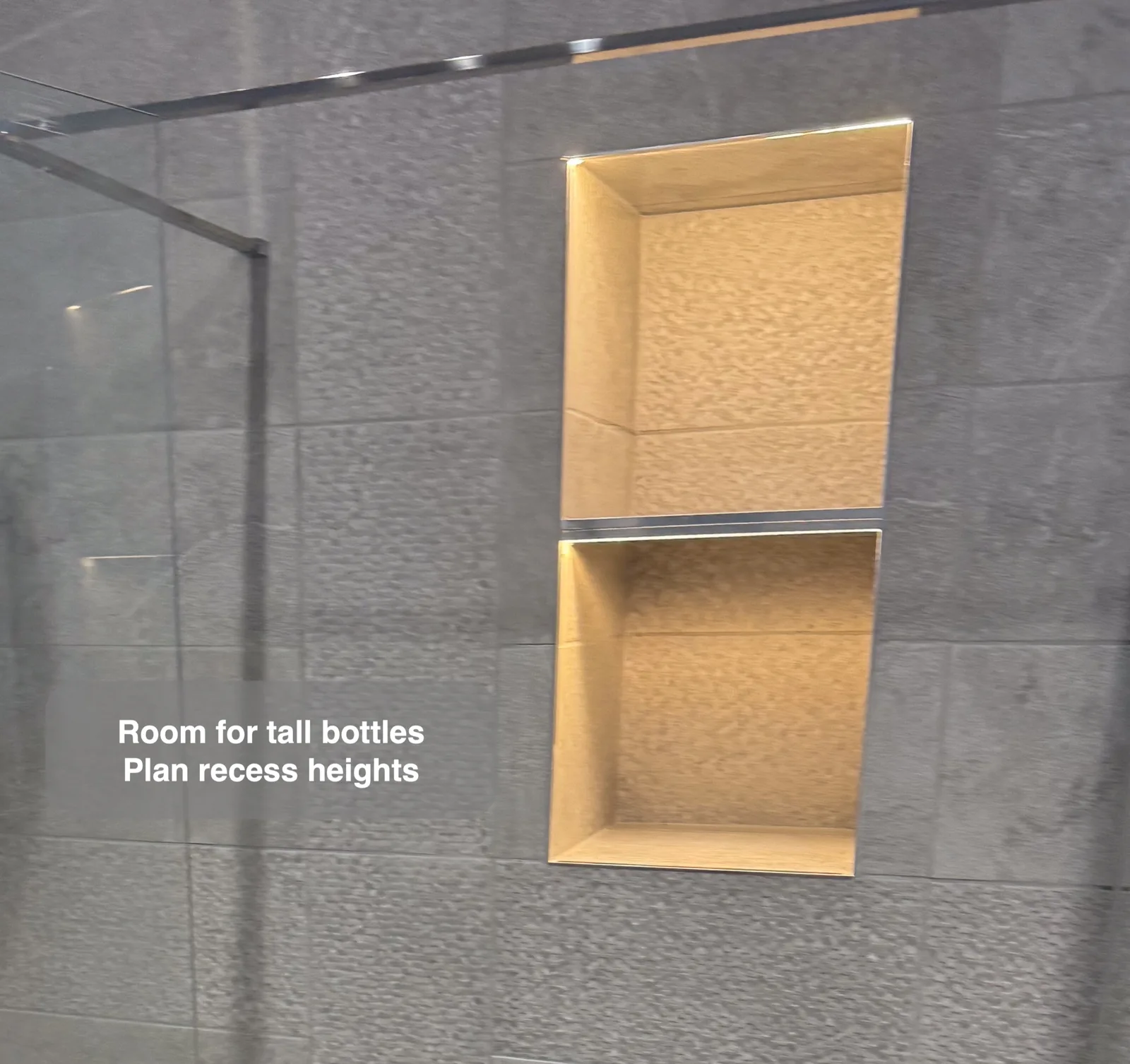 Two illuminated shower recesses with different opening heights