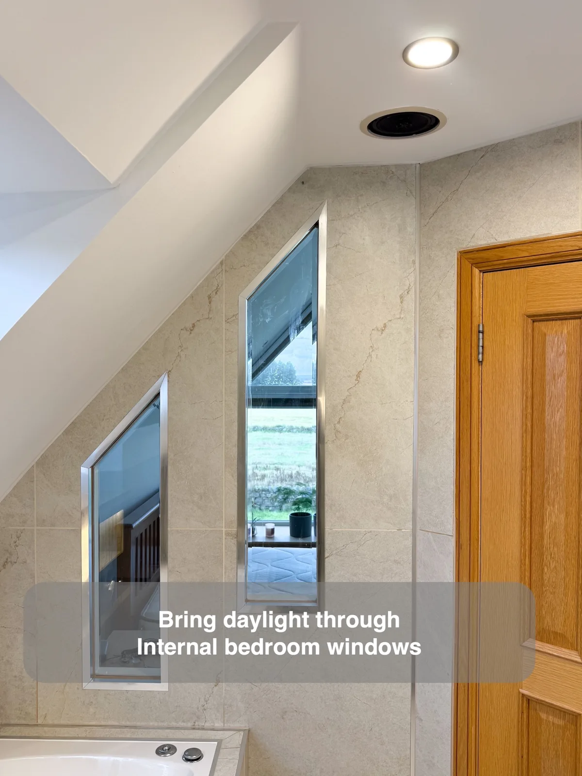 Angled internal windows bringing daylight into an ensuite, with benefit callouts