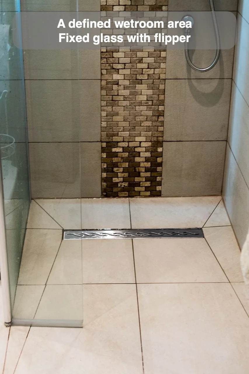 A defined wetroom area — Fixed glass with flipper