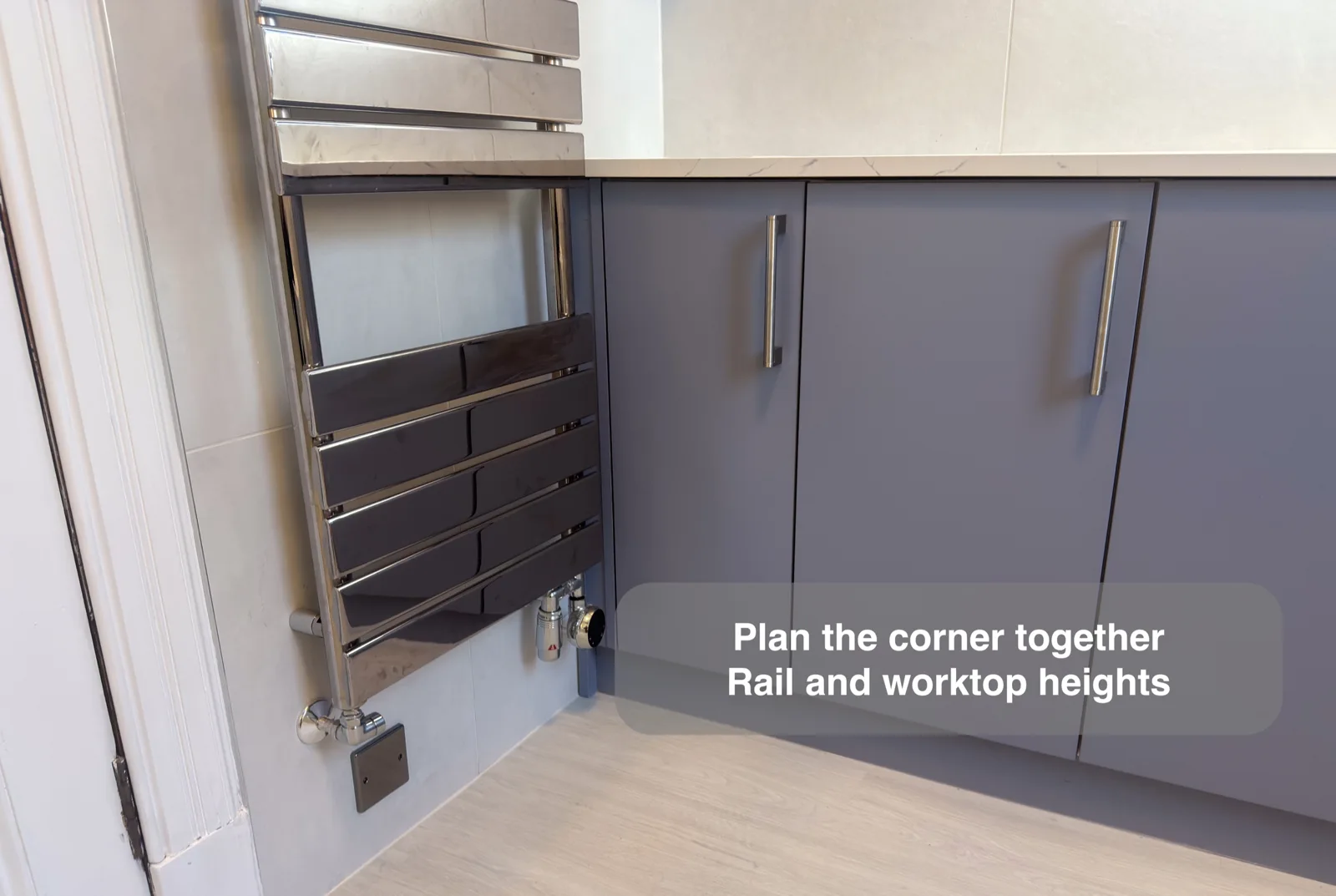 Chrome towel rail bar spacing coordinated with a fitted vanity worktop