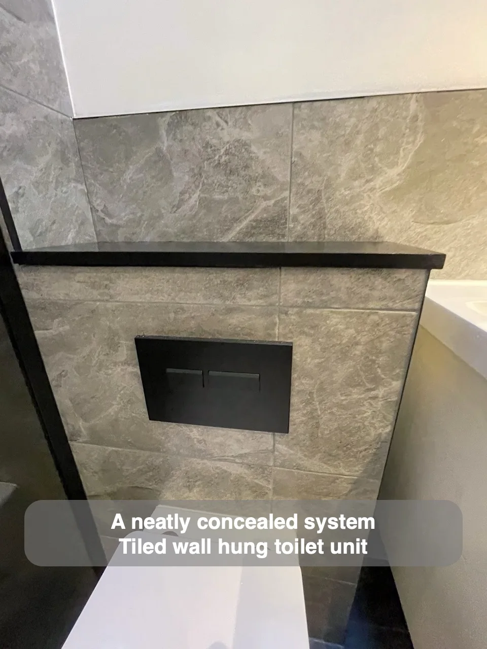 A neatly concealed system — Tiled wall hung toilet unit