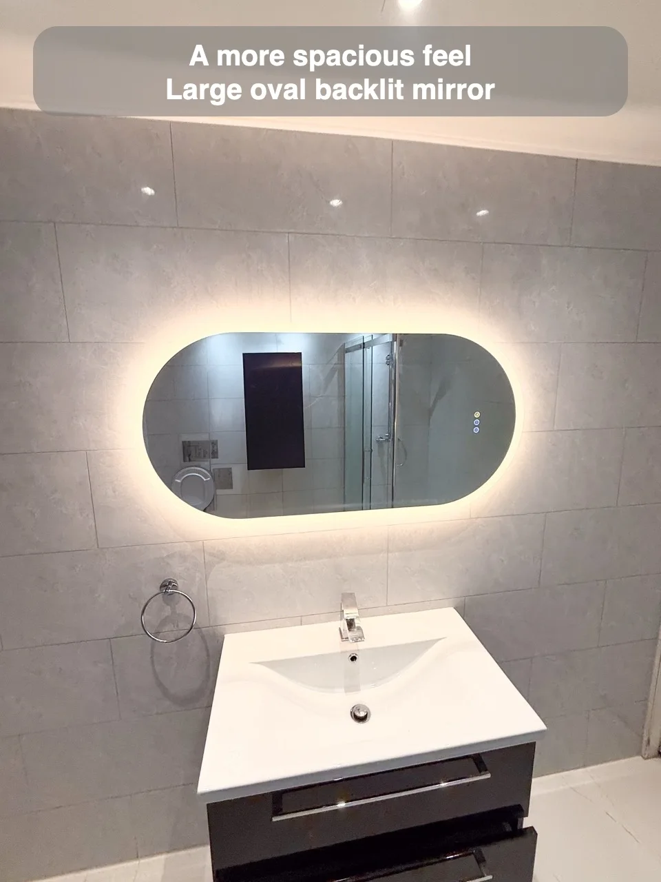 A more spacious feel — Large oval backlit mirror