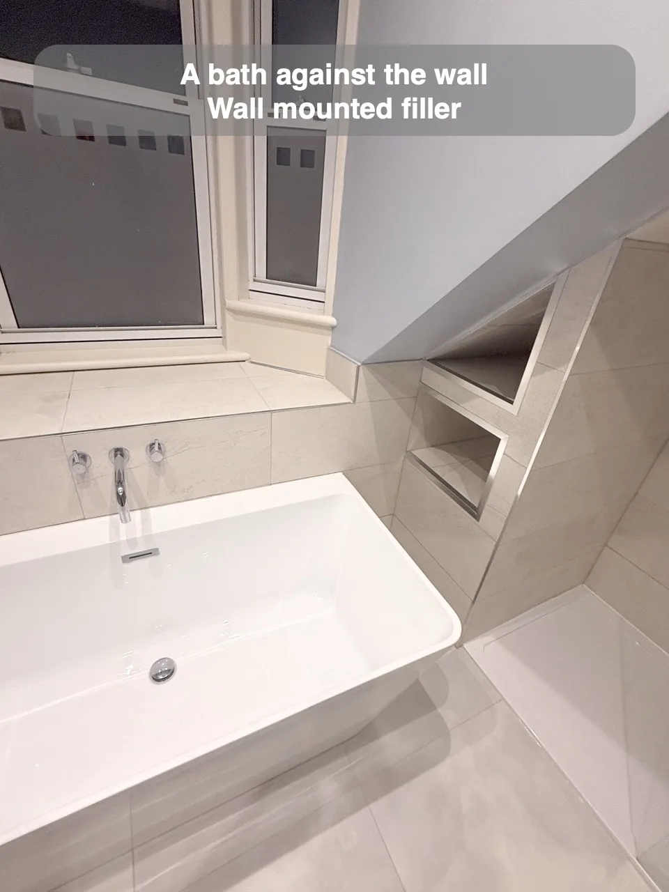 A bath against the wall — Wall mounted filler