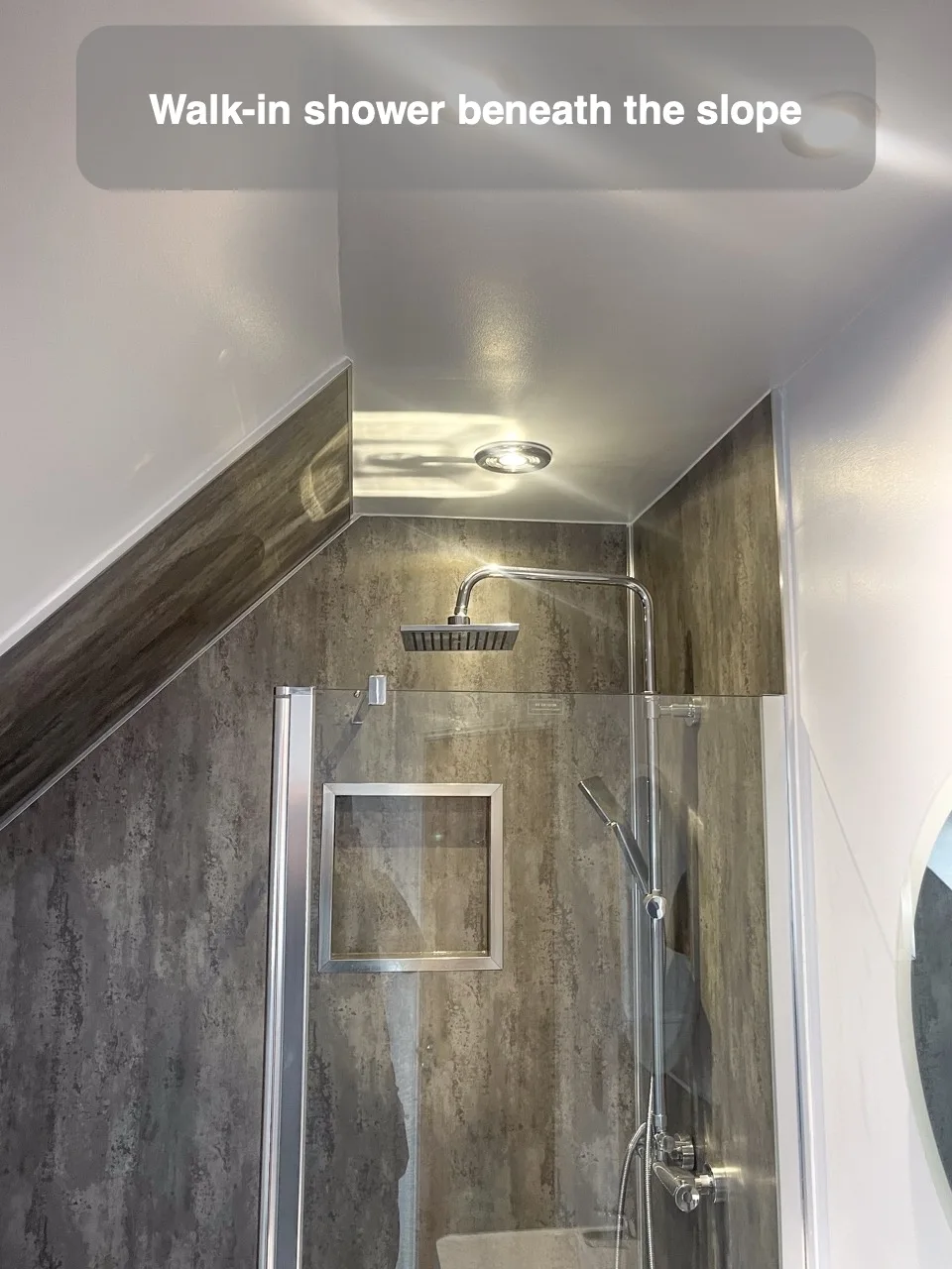 Walk-in shower beneath the slope