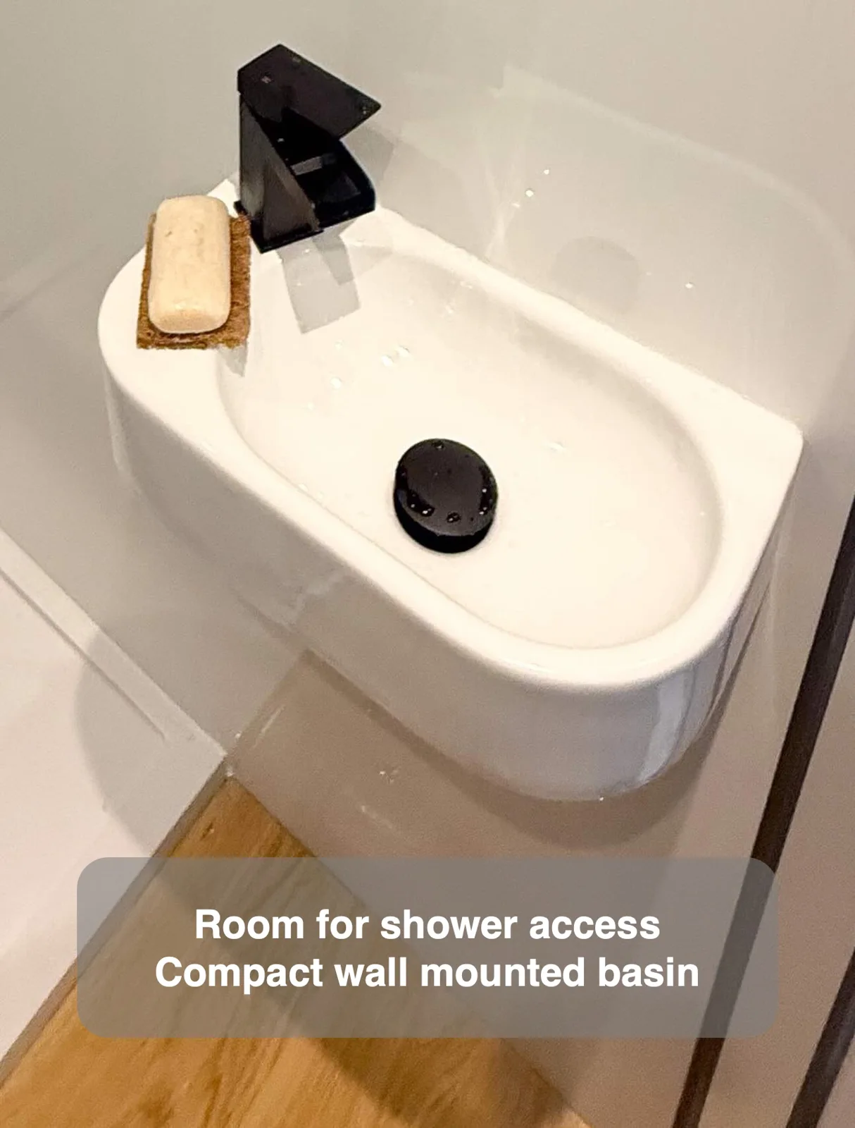 Room for shower access — Compact wall mounted basin
