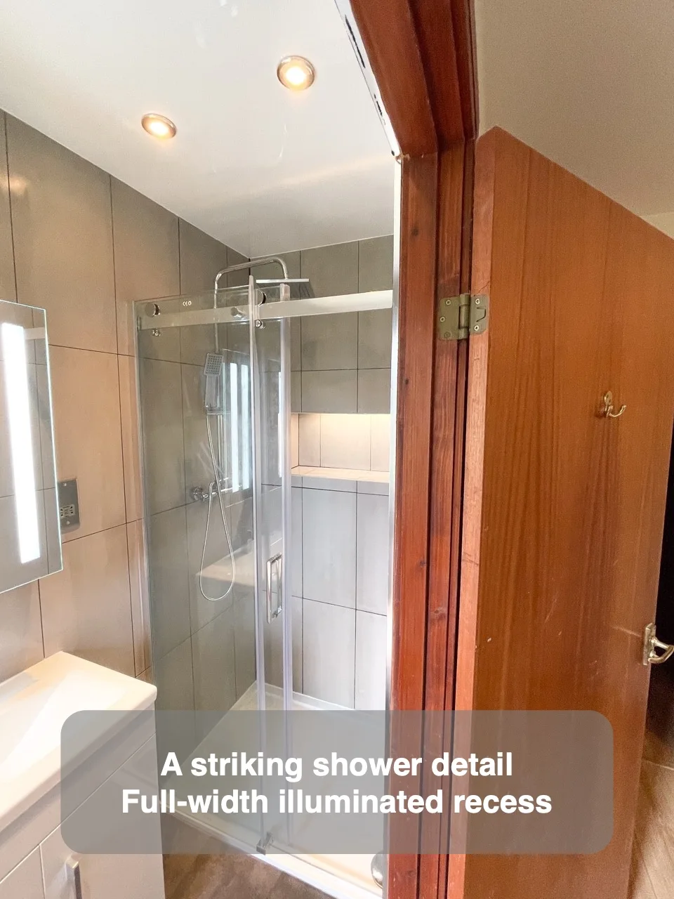 A striking shower detail — Full-width illuminated recess