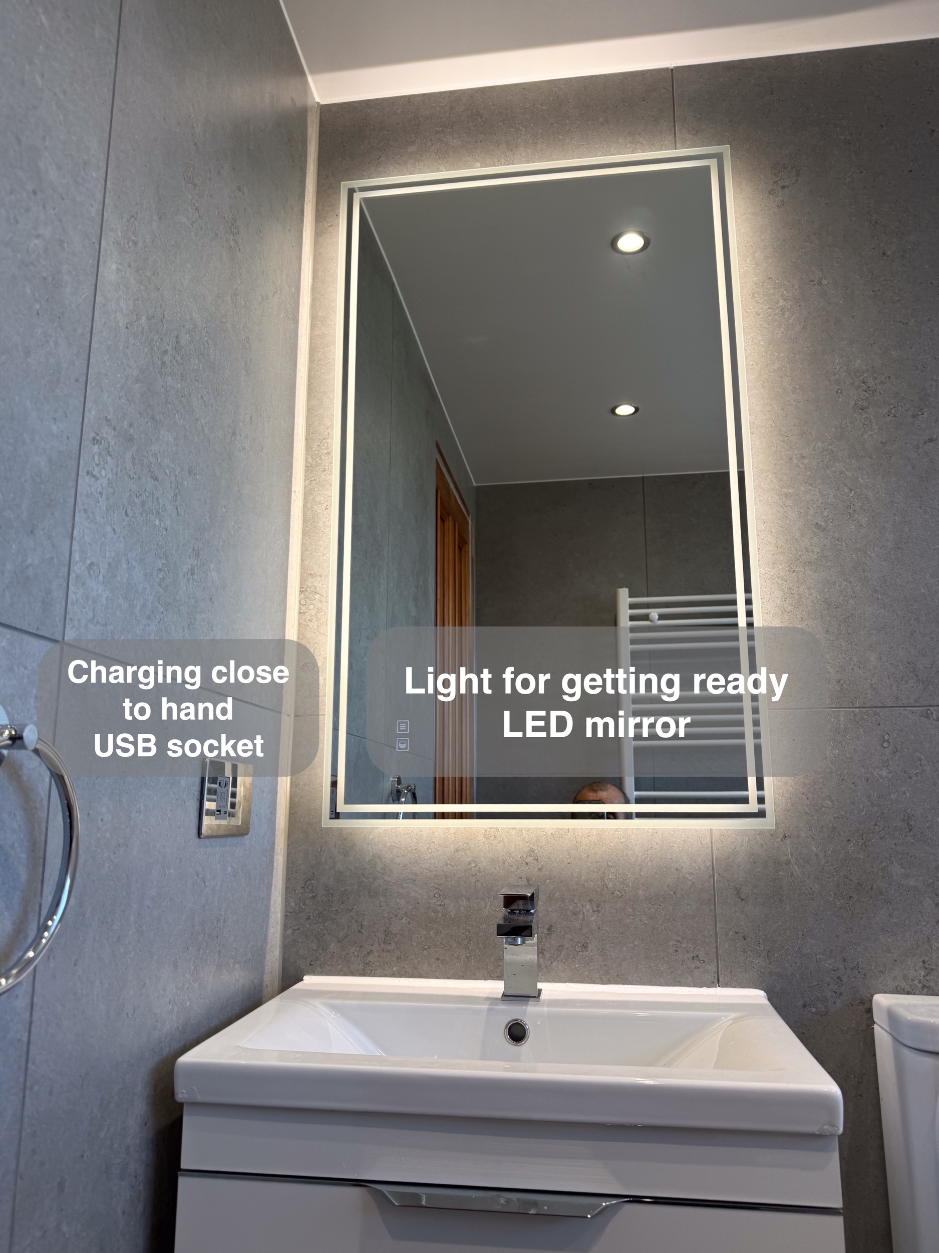 Illuminated mirror and USB socket in the completed Aberdeen bathroom, with benefit callouts.
